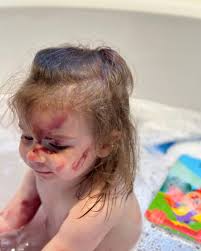 The result of two tubes of mom's lipstick and 5 minutes all to herself. Is  this what people call a core memory? My favorite part was that Laura and I  reacted by