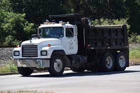 Dump trucks can usually carry about 10 to 14 cubic yards of dirt. How Many Cubic Yards Are In A Dump Truck