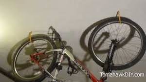 The hand operated pulley system helps you lift and lower heavier objects. Organize Garage How To Hang Bikes From The Ceiling Youtube