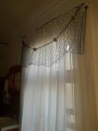 Choose from distinct styles, decorative borders, custom material and more. Curtains With Fish Net Draping Beach Cottage Decor Nautical Window Treatments Beach Cottage Design