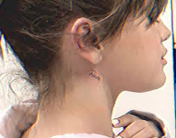 Selena gomez's second tattoo is a roman numeral on the back of her neck. Selena Gomez Shows Off New Neck Tattoo Dedicated To An Emotional
