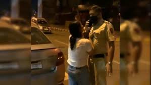 police officer: Drunk girl abuses police officer, video goes viral on  Twitter - The Economic Times