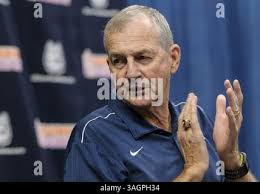 Thursday September 13, 2012: Jim Calhoun's family (L-R) son Jim Calhoun  Jr., his wife Pat Calhoun, and his son Jeff Calhoun look on, at his  announcement of retirement from coaching at Gampel
