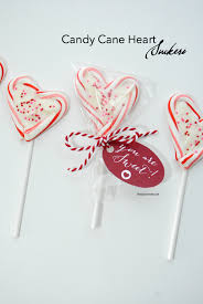 Heart shaped lollipops sprinkled with mixed heart sprinkles are a fun party favor for valentines day. Candy Cane Heart Suckers The Idea Room