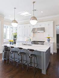 White kitchen cabinets with dark gray island. Hallie Henley Design White Kitchen Interior Design White Kitchen Interior White Kitchen Design