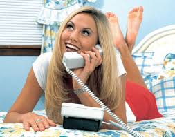 Cheerful pretty young woman talking on cellphone. Phone A Shade Of Pen