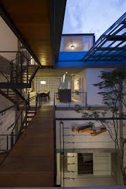 Main idea of the timber house is the indoor environment quality reached by the inner courtyard in the middle which is hidden from outside on this small site. Three Story Courtyard House