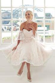 The style of short dresses tends to be a good fit with outdoor, beach, and more casual weddings for brides who want to wear white, bridal gown with a skirt that falls above the knee. 14 Short Wedding Dresses And Little White Dresses For Your Intimate Ceremony Virtual Wedding And Beyond Praise Wedding