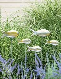 Metal beach wall art decor set of 3 metal seaturtle fish and crab with stained. These Eye Catching Garden Ornaments Go So Far Beyond Gnomes Outdoor Garden Decor Fish Garden Metal Garden Art