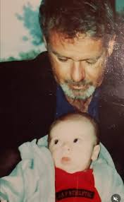 Justin's Dad, Billy McGuire, this is the first time he met his first and  only grandchild, his grandson Dylan. You can see the sparkle in his eyes,  his smile, his heart full.