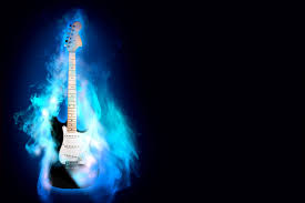 Young man playing electric guitar and fire surrounding instrument on dark background. Guitar Wallpaper 169 1500x1000 Pixel Wallpaperpass