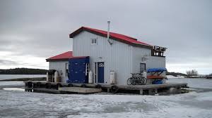 The Artic Houseboat Sits On An Icy Pond In Yellowknife Canada House Boat Floating House Utility Boat