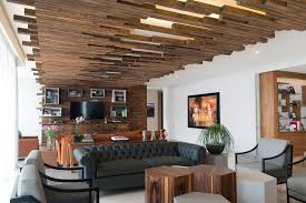 Acoustic panels can be mounted on wood panels for rear isolation. The Decorative Ceiling Design In This Living Room Will Get Your Attention