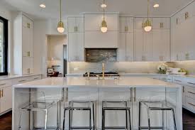 Makeover a dated kitchen using brass hardware, lighting, and appliances. White Modern Kitchen With Brass Fixtures Hgtv