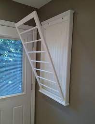 Some of the best clothes drying racks available in india's if you can't hang your clothes outside in the sun, which is the best, there are several clothing rack designs available which would work inside the. Ingeniously Simple Door With Metal Rods For Drying Clothes And Storage Wall Mounted Clothes Drying Rack Wall Mounted Drying Rack Indoor Clothes Drying Rack