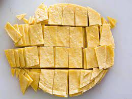 How To Make Tex Mex Migas Scrambled Eggs With Tortilla Chips Onion And Chilies