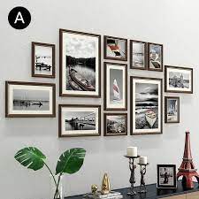 You can opt to keep everything uniform in modern black frames or stick with a photo theme, like black and white. Wooden Wall Frames 12er Set Modern Style Bilder Wand 12er Bilder Frames Modern Set Style Picture Wall Living Room Photo Wall Decor Frames On Wall