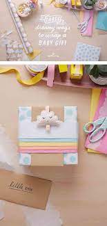 Get the tutorial via ourownkindofparadise. Easy And So Very Sweet Three Dreamy Baby Gift Wrap Ideas Think Make Share Baby Gift Wrapping Baby Shower Wrapping Baby Gifts