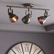 A few ideas (in concept) are below the more lights to direct to different directions the better. Farmhouse Track Lighting Lamps Plus
