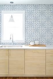 Not to mention, the white grouts highlight the tiles. The Duplex Kitchen Backsplashes Are In Young House Love