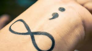 This person chose to have their's done behind the ear. Semicolon Tattoos 25 Unique Collections Design Press