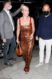 Katy perry has stepped out with her fiance orlando bloom and their adorable daughter daisy dove for a day katy perry takes a dip in a purple onepiece with baby daisy & shirtless orlandoin greece. Freedomroo Katy Perry Slips Into A Daring Snakeskin Jump Suit As She Arrives To Kendall Jenner S 818 Party Australiannewsreview