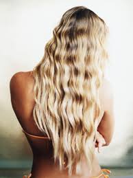 Womans blonde hair on black textile. Can Your Hair Color Lighten From Brown To Blonde Naturally On Its Own Allure