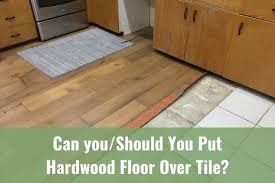 I completely gutted the kitchen and had planned on installing the hardwood floor under the new kitchen cabinets. Can You Should You Put Hardwood Floor Over Tile Ready To Diy