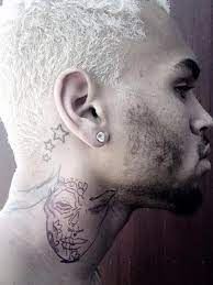 But his latest ink is drawing controversy. Chris Brown Shows Off Neck Tattoo Of Beaten Woman With Striking Resemblance To Rihanna