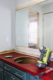 How to frame your bathroom mirrors. Diy Mirror Frame Frame Your Bathroom Mirror For Less Than 20