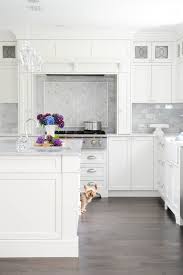 Enviable Designs Fabulous Kitchen Features Shaker Cabinets Paired With White Quartz Counte White Kitchen Design Kitchen Design Trends House And Home Magazine