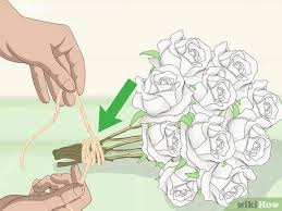 Unrecognizable mother holding small daughter upside down outdoors in spring nature. 3 Ways To Preserve A Bouquet Wikihow