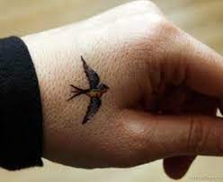 Marvelous black inked birds tattoo. 43 Fancy Birds Tattoos On Hand
