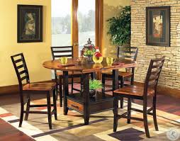 Seats are taller too, though they must maintain the same amount of space between the tabletop and the sitter (usually about 1 foot). Abaco Extendable Round Counter Height Dining Table From Steve Silver Ab200ptb Ab200pt Coleman Furniture