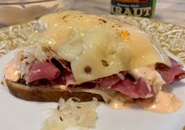 The reuben sandwich is an american grilled sandwich composed of corned beef, swiss cheese, sauerkraut, and russian dressing, grilled between slices of rye bread. A St Patrick S Day Favorite Open Faced Reuben Sandwich Macaroni Kid Macaroni Kid Eats