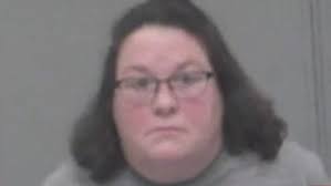 White woman arrested after pointing gun at two Black boys riding their bikes