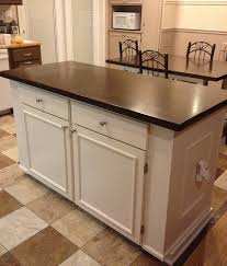 Stylish design features include a solid hardwood, distressed oak finished top with profiled edges; Kitchen Island With Farmhouse Table Top Ana White