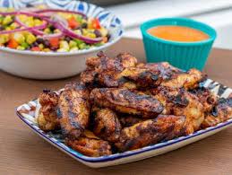 These sriracha chicken wings are super popular despite being super spicy. Smoked Chicken Wings Recipe Michael Symon Food Network