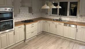 After photo of linen white painted kitchen cabinets. Are Painted Kitchen Cabinets Durable Kitchen Spray Painting