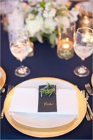 Navy and gold reception with skyline views. Gold And Navy Wedding Table Decor Deer Pearl Flowers