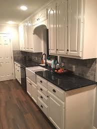 off white kitchen cabinets with black