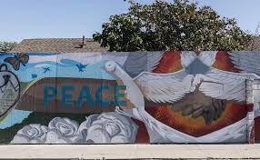 Black And Brown Unity Mural Artwork At The Watts Towers A Collection Of Structures And Art In The Low Income Watts Section Of Los Angeles California Murals Street Art Street Art Artwork