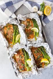 Cooking time for salmon foil packets can be hard to judge. Four Salmon Fillets On A Baking Tray In Foil With Asparagus And Lemon Wedges With Garlic And Lemon I Salmon Fillet Recipes Spring Recipes Dinner Cooking Salmon