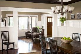 Open Floor Plan With Entry Living Room And Dining Room Of Remodeled Craftsman House With Built In Bookcases And Wainsc Home Craftsman Interior Home Remodeling