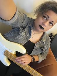 Heya, I don't normally post often, but I thought I'd share this photo of me  with my beloved, heavily modded p bass copy from last year with my last  band, Diablofurs. It