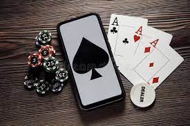 Online Poker Casino Theme. Gambling Chips, Smartphone and Playing Cards on  Wooden Background Stock Photo - Image of poker, isolated: 195808906