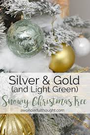 We are excited to share with you our new range of christmas decorations. Silver Gold And Light Green Snowy Christmas Tree A Wonderful Thought