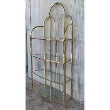 This vintage shelf rail has many uses. Vintage Brass Etagere Arched Glass Display Shelf With Four Shelves Chairish