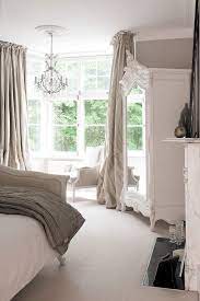 This bedroom shows off gray's whimsical side with the aforementioned dots on the european shams and the curtains. More Shades Of White From The Paper Mulberry Neutral Bedroom Design Bedroom Design Home