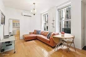 Essential pieces in a balanced living room include the sofa, coffee table, walls, and the tv cabinet. Apartment Lighting Ideas 10 Easy Ways To Brighten A Room Streeteasy